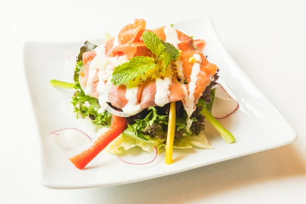 Salmon salad in white plate — Stock Photo, Image