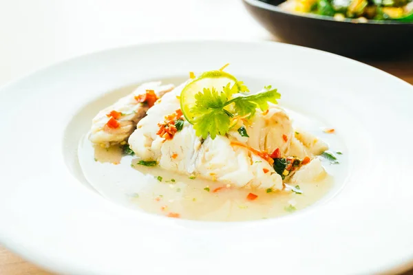 Steam fish fillet meat with lemon spicy sauce — Stock Photo, Image