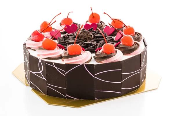 Üzerinde kiraz olan çikolatalı pasta.