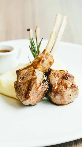 Grilled rack of lamb meat with sauce — Stock Photo, Image