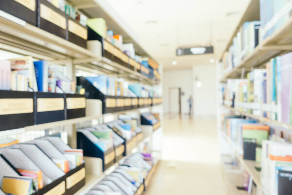 Abstract blur and defocused bookshelf in library
