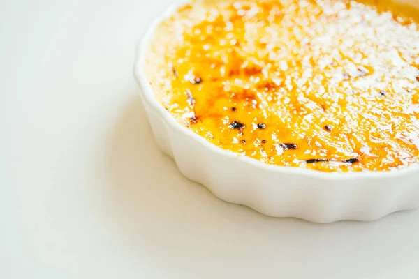 Vanilla cream brulee sweet dessert in white plate - Color Filter Processing — Stock Photo, Image