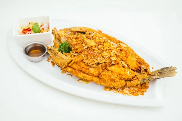Fried sea bass meat fish with sauce — Stock Photo, Image
