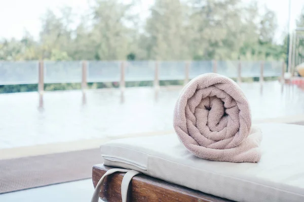 Rolling towel on sunbed — Stock Photo, Image