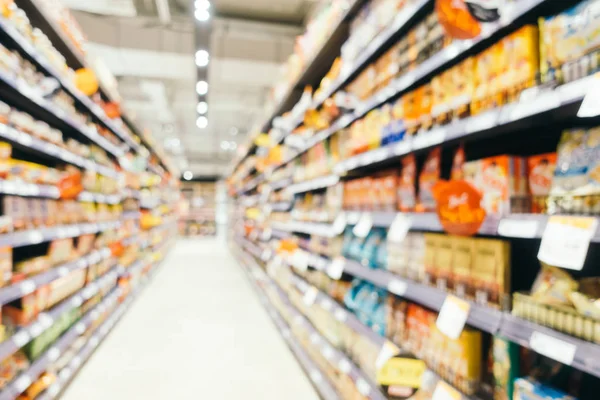 Soyut bulanıklık ve süpermarkette alışveriş bölümü s defocused
