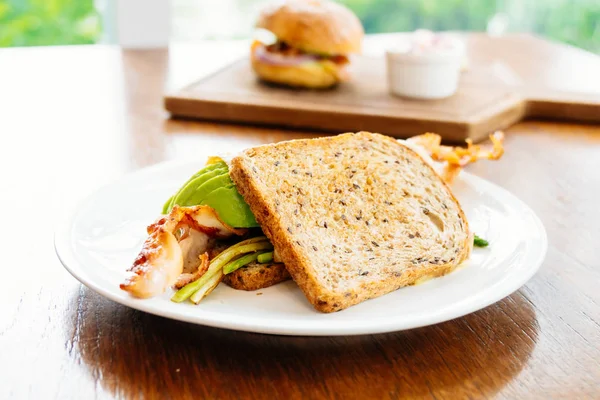 Sandwich with avocado bacon and asparagus — Stock Photo, Image