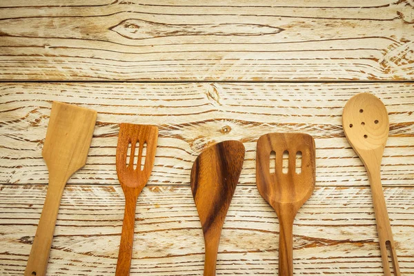 Wood utensils or kitchen ware on wooden table with copy space - Vintage Filter