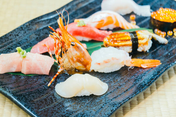 Mixed Raw and fresh salmon tuna shrimp and other sushi - Japanese food style