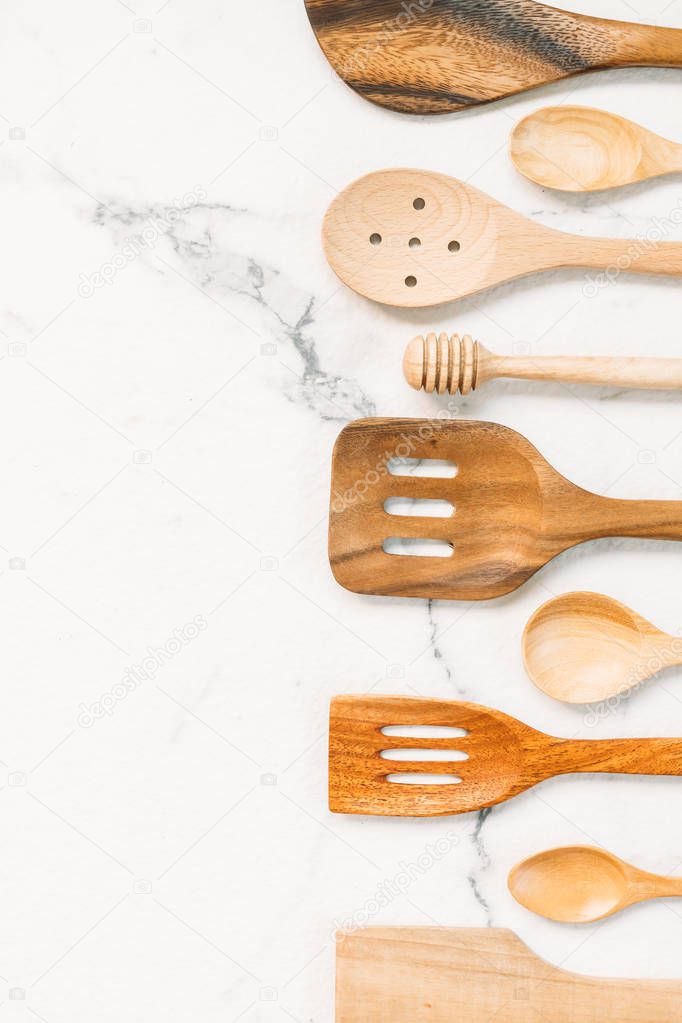 Kitchen utensils with copy space on white marble stone background