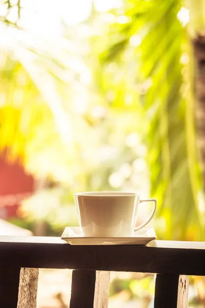 White coffee cup around outdoor patio - Filter Processing