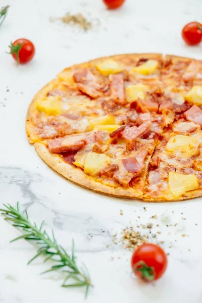 Hawaiian pizza with pineapple and ham - Unhealthy food style
