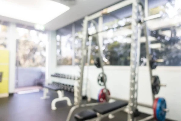 Abstract blur and defocused sport fitness equipment in gym inter — Stock Photo, Image