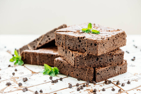 Sweet dessert with chocolate brownies on white stone background