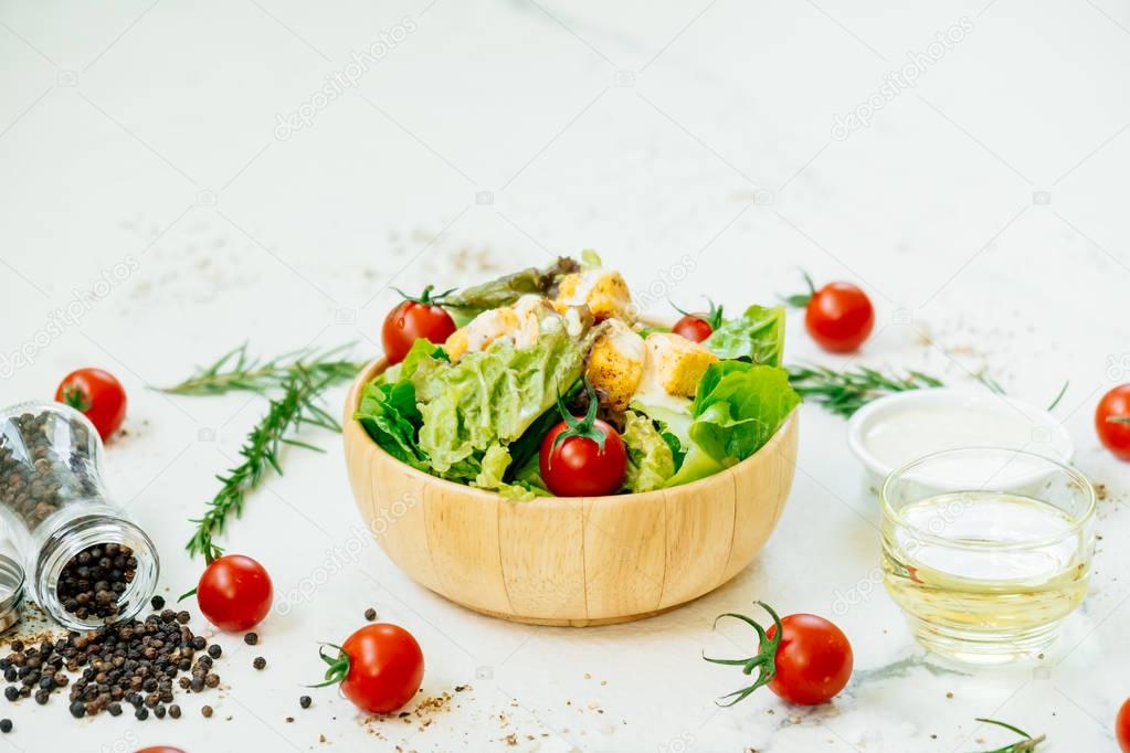 Clean and healthy food style with Caesar salad in wooden bowl