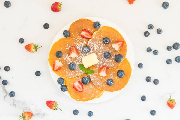 Healthy Breakfast set with Pancake blueberry and strawberry fruits on stone table background