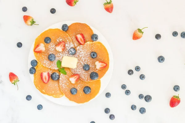 Healthy Breakfast set with Pancake blueberry and strawberry fruits on stone table background