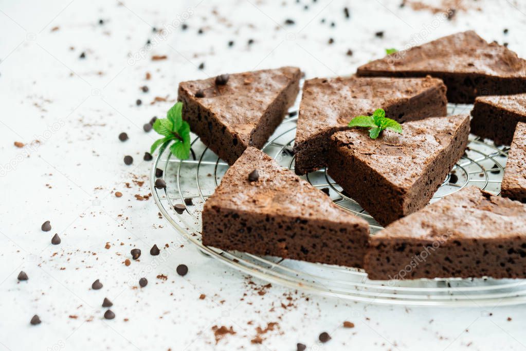Sweet dessert with chocolate brownies on white stone background