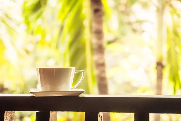 White coffee cup around outdoor patio