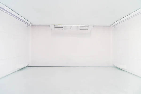Empty and open refrigerator interior for background
