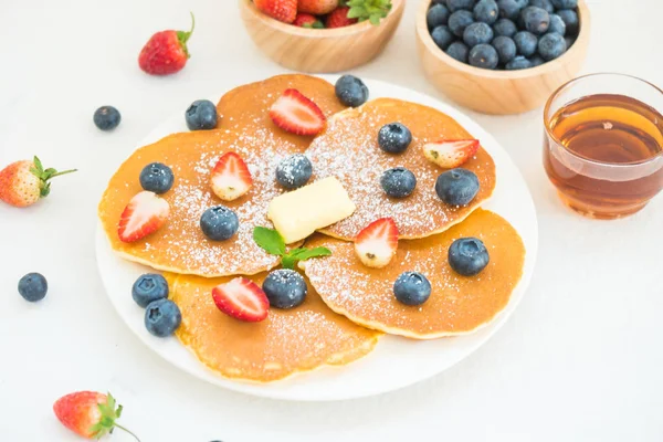 Healthy Breakfast set with Pancake blueberry and strawberry fruits on stone table background