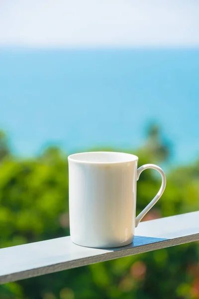 White coffee cup with sea view and copy space