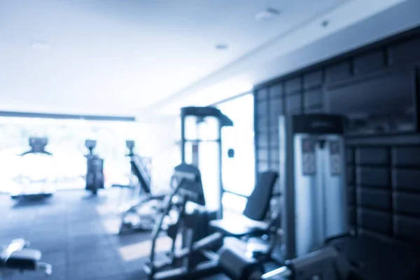 Abstract blur defocused fitness equipment and gym interior — Stock Photo, Image