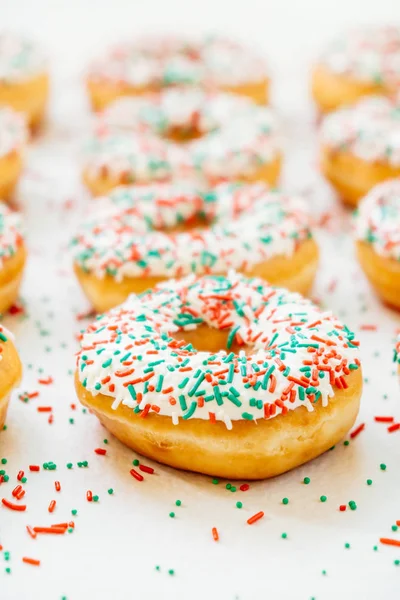 Donuts with white chocolate cream and sprinkles sugar — Stock Photo, Image