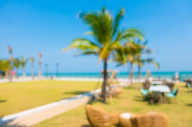 Soyut bulanıklık ve sahilde ufuk açık restoran ve 