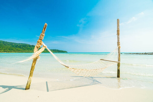 Hammock  with Beautiful nature tropical beach and sea with cocon