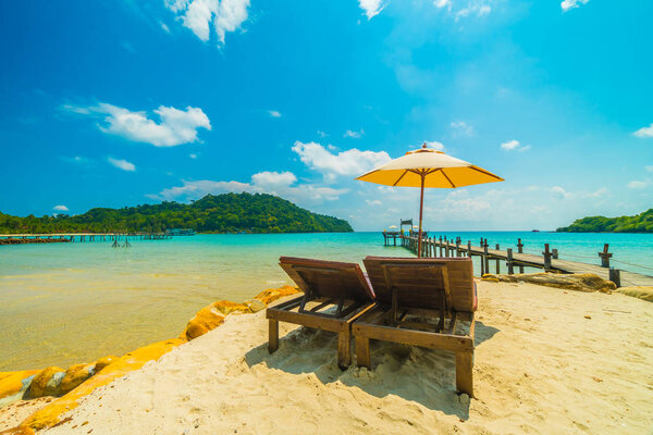 Beautiful tropical beach and sea with coconut palm tree in parad