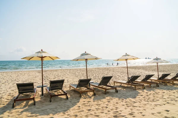 Umbrella and chair on the beach and sea — Stock Photo, Image