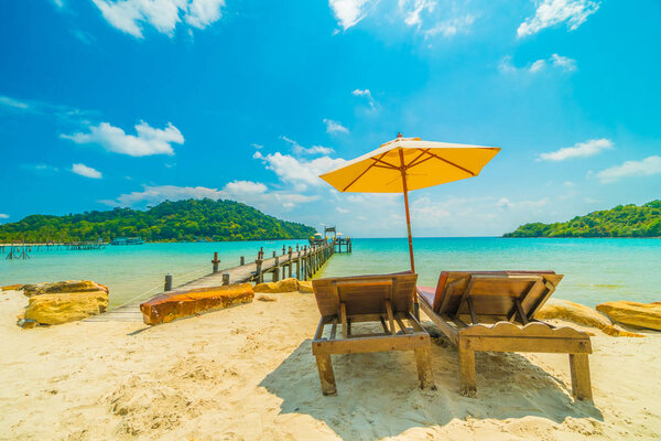 Beautiful tropical beach and sea with coconut palm tree in parad