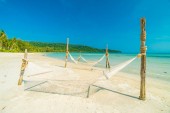 Картина, постер, плакат, фотообои "hammock on beautiful tropical beach with coconut trees and sea on background", артикул 195345440