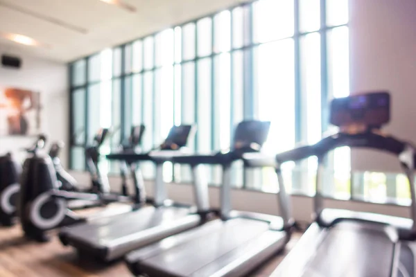 Abstract blur and defocus fitness equipment in gym room interior — Stock Photo, Image