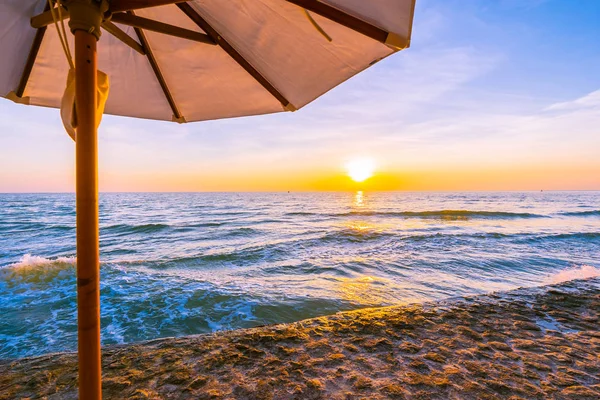 Umbrella and chair with pillow around beautiful landscape of bea — Stock Photo, Image