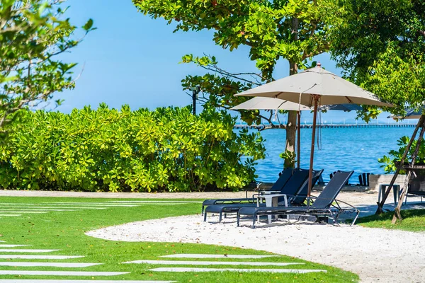 Umbrella and chair on the beach and sea with blue sky — Stock Photo, Image