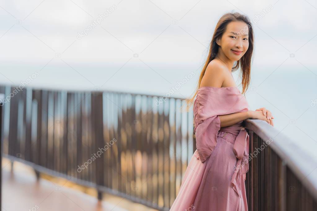 Portrait beautiful young asian woman looking sea beach ocean for