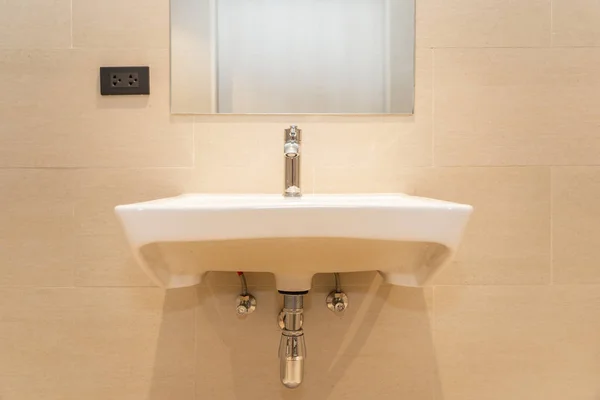 White sink with water faucet decoration in bathroom