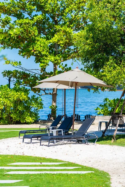 Umbrella and chair on the beach and sea with blue sky — Stock Photo, Image