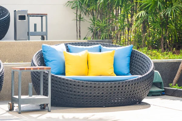 Outdoor patio in the garden with sofa chair and pillow decoratio — ストック写真