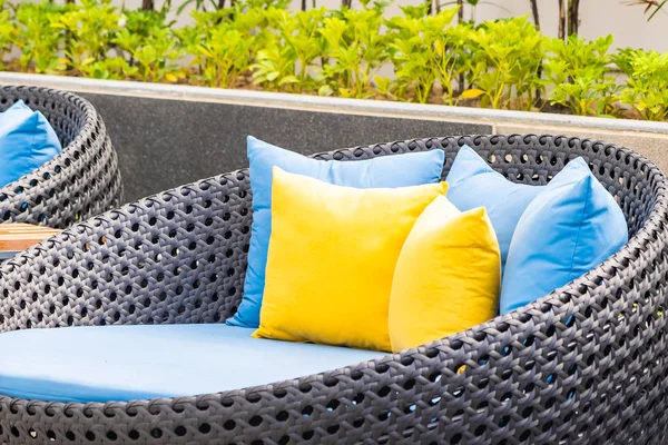 Outdoor patio in the garden with sofa chair and pillow decoratio