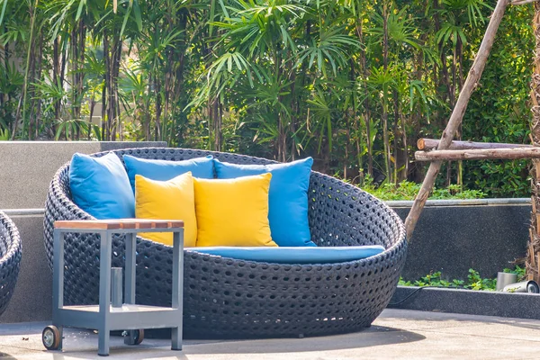 Outdoor patio in the garden with sofa chair and pillow decoratio — ストック写真
