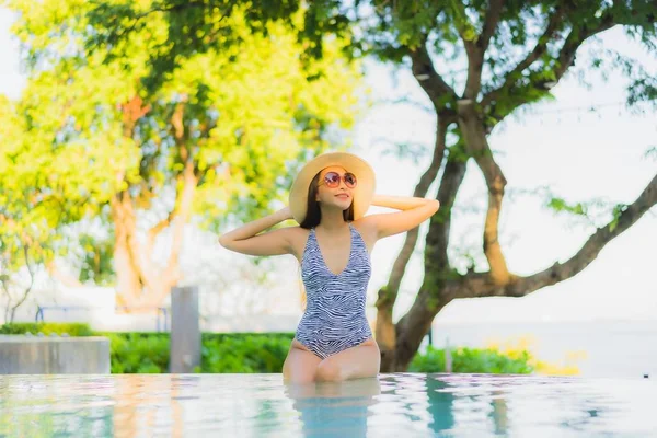 Beautiful young asian women happy smile relax around outdoor swi — ストック写真