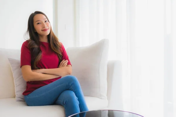 Portrait beautiful young asian women happy smile sit on sofa — Stock Photo, Image