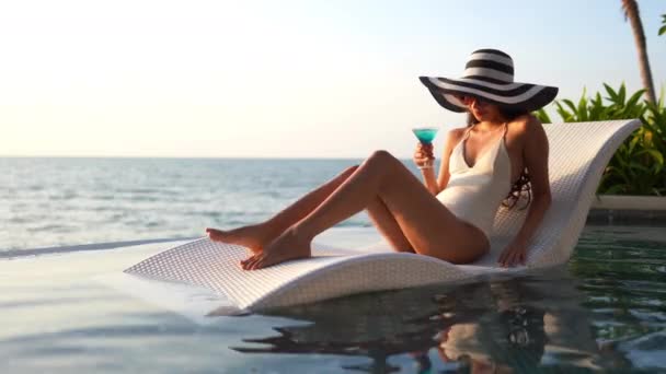 Beautiful Young Asian Woman Relaxing Swimming Pool — Stock Video