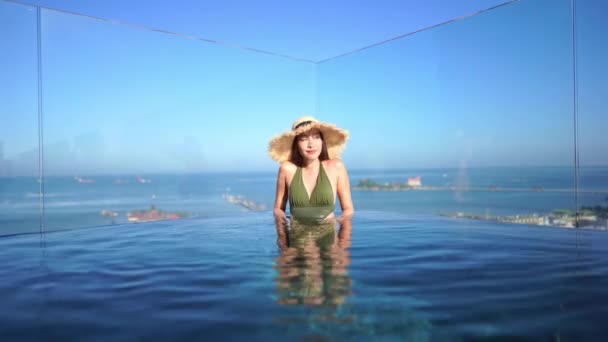 Beautiful Young Asian Woman Relaxing Swimming Pool — Stock Video