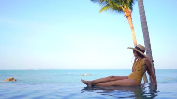 Beautiful Young Asian Woman Relaxing Swimming Pool — Stock Video