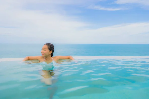 Portrait young asian woman relax smile happy around outdoor swim — Stock Photo, Image