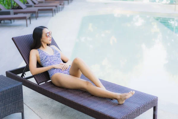 Beautiful young asian women happy smile relax around outdoor swi — ストック写真