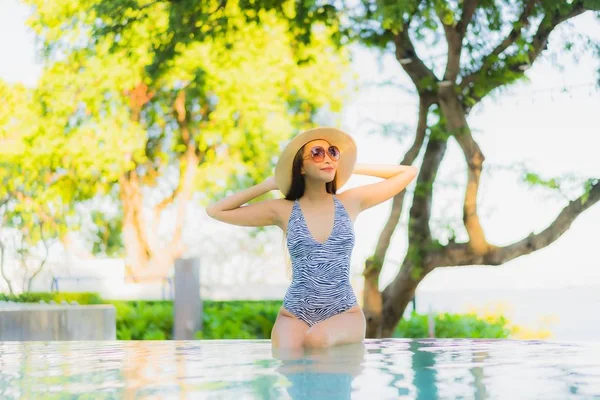 Beautiful young asian women happy smile relax around outdoor swi — ストック写真